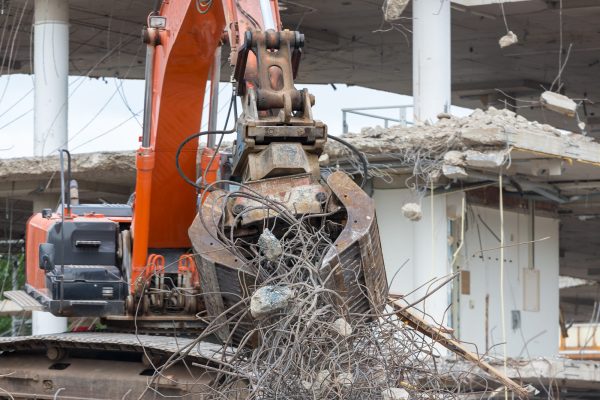 Demolition of a building with concrete floors and pillars